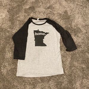 A grey and black Minnesota shirt